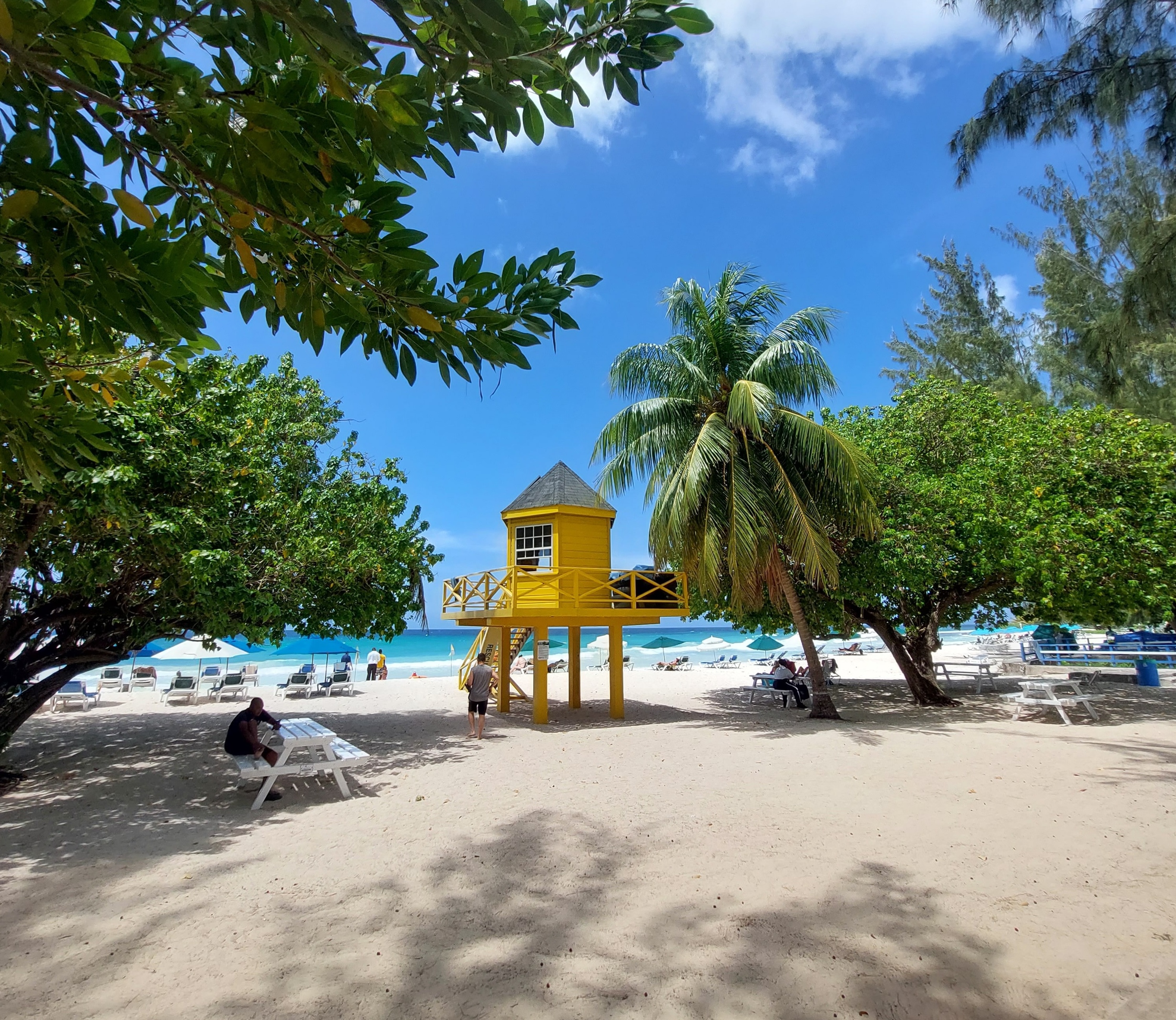A bright yellow lifeguard tower on Rockley Beach